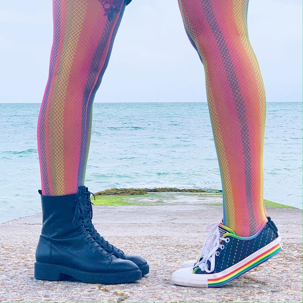 Model wearing rainbow coloured fishnets